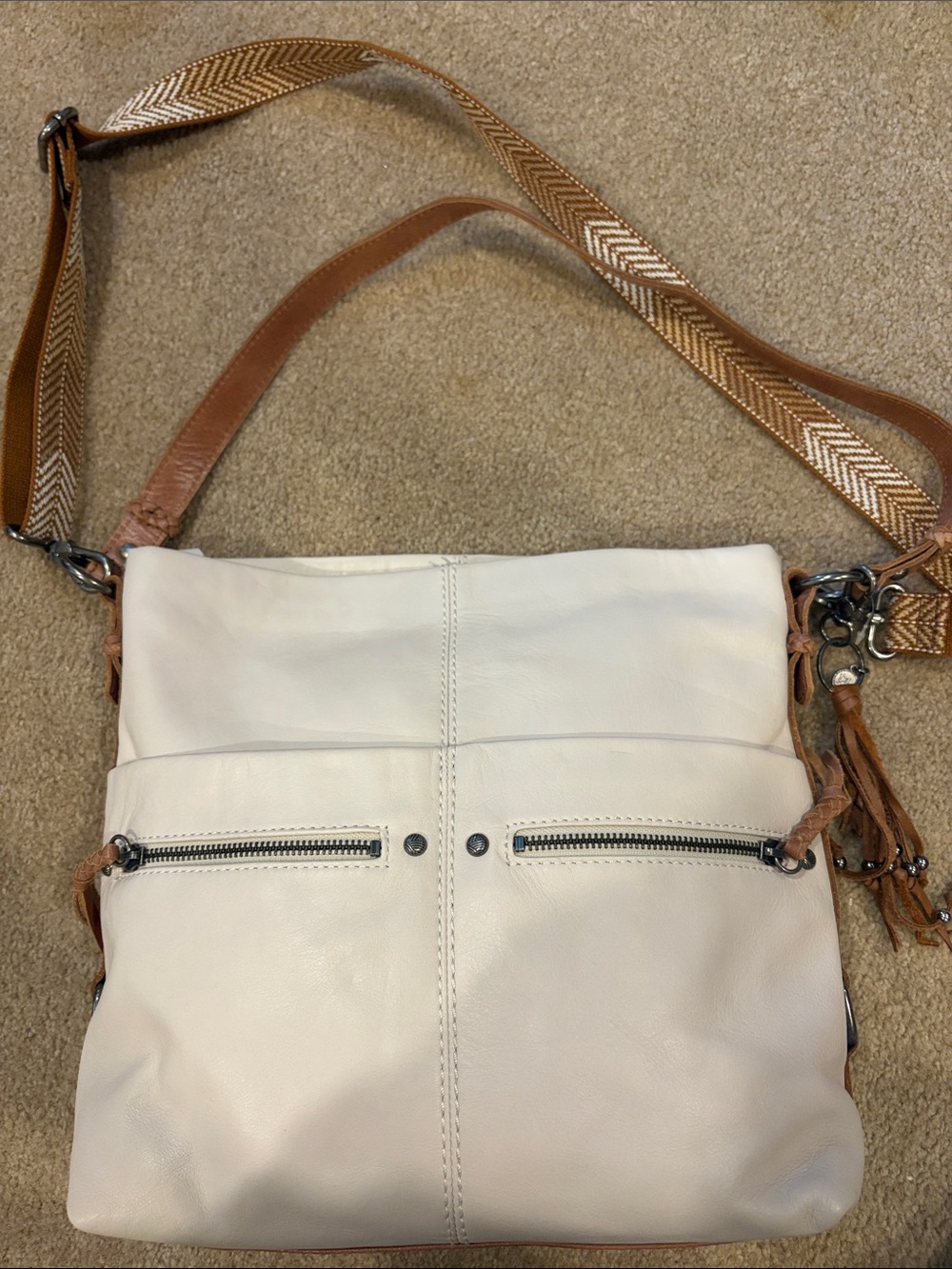 The Sak White Crossbody Bag with Tan Strap and Tassel